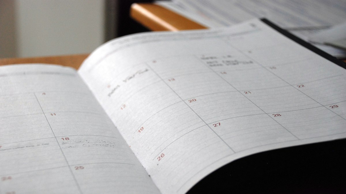 An open monthly planner on a desk
